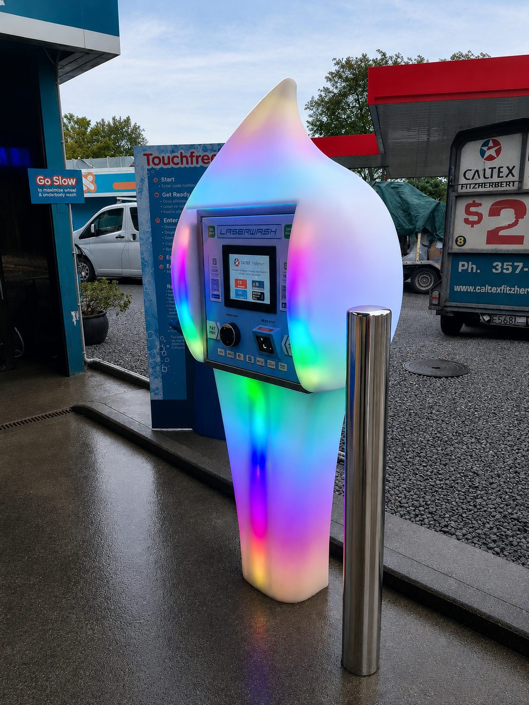 A pastel-lit Paydrop plinth beside the payment bollard