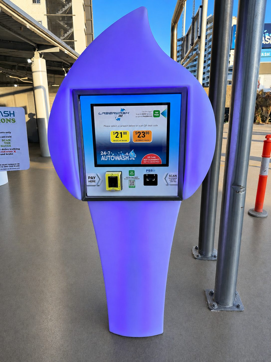 A purple Paydrop plinth showing wash prices