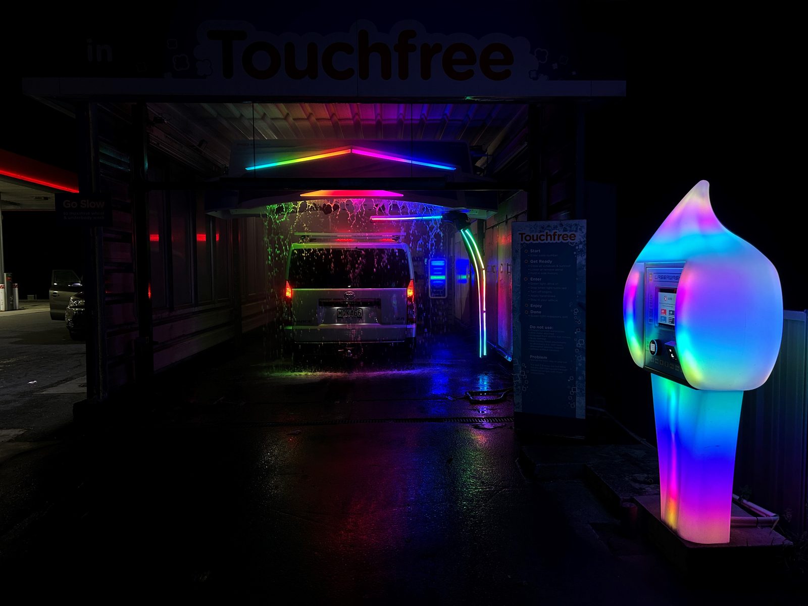 A Paydrop plinth guiding a driver into the Touchfree wash bay