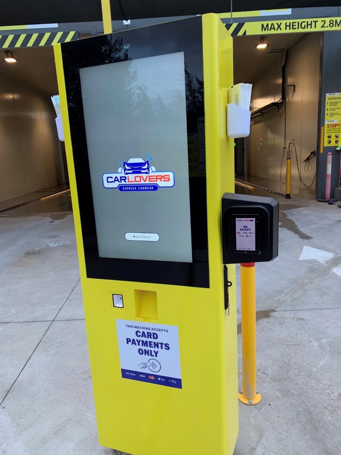 The Paydrop plinth glowing at the wash entry