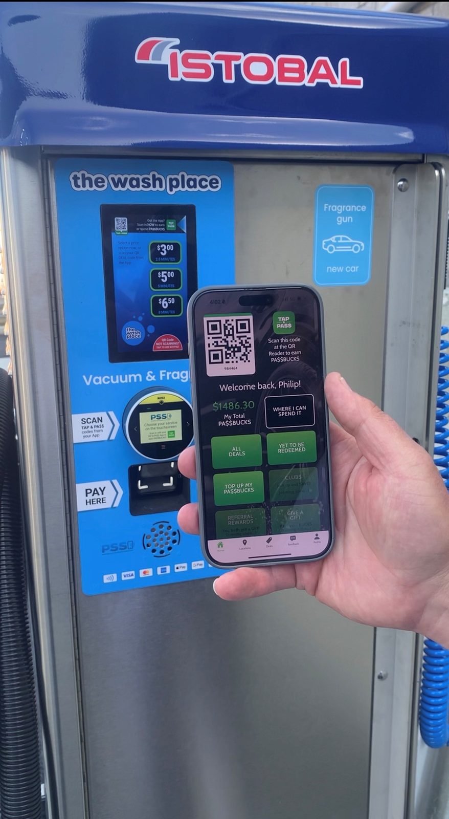 A customer using the TAP n PA$$ app at the Istobal vacuum